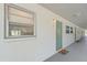 Exterior hallway of condo building featuring unit door and window at 3717 46Th S Ave # 6, St Petersburg, FL 33711