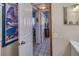 Hallway with tile flooring leading to the bathroom and kitchen, providing easy access to various spaces at 3717 46Th S Ave # 6, St Petersburg, FL 33711