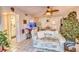 Living room featuring tiled floors, a tropical fish tank, and a festive Christmas tree at 3717 46Th S Ave # 6, St Petersburg, FL 33711