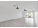 Bright and spacious living room with tile flooring and sliding glass doors to patio at 3717 46Th S Ave # 6, St Petersburg, FL 33711