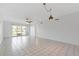 Spacious living room features tile floors and sliding glass doors to a balcony at 3717 46Th S Ave # 6, St Petersburg, FL 33711