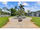Relaxing outdoor patio area with seating, a fire pit, and lush landscaping, perfect for entertaining at 3717 46Th S Ave # 6, St Petersburg, FL 33711