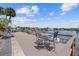Charming outdoor patio with dining set and serene waterfront views, perfect for relaxation at 3717 46Th S Ave # 6, St Petersburg, FL 33711