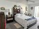 Bedroom with a wooden bed frame, coastal decor and ample closet space at 4525 Cove Cir # 1002, St Petersburg, FL 33708
