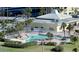 Community pool with star shape and surrounding patio at 4525 Cove Cir # 1002, St Petersburg, FL 33708