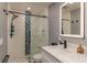 Modern bathroom with updated fixtures and a walk-in shower at 4925 New England Blvd # 204, New Port Richey, FL 34652