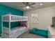 Bedroom with a bunk bed and teal walls at 4925 New England Blvd # 204, New Port Richey, FL 34652