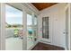 Deck access from sunroom, offering backyard views at 4925 New England Blvd # 204, New Port Richey, FL 34652