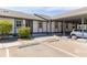 Exterior view of condo with parking and landscaping at 4925 New England Blvd # 204, New Port Richey, FL 34652
