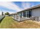 View of home's exterior and backyard deck at 4925 New England Blvd # 204, New Port Richey, FL 34652