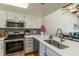 Modern kitchen with stainless steel appliances and island at 4925 New England Blvd # 204, New Port Richey, FL 34652