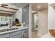 Kitchen with view into bathroom and living room at 4925 New England Blvd # 204, New Port Richey, FL 34652