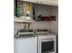 Laundry closet with washer, dryer, and shelving at 4925 New England Blvd # 204, New Port Richey, FL 34652