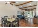 Open living area with hardwood floors, vaulted ceilings, and a comfy sectional sofa at 4925 New England Blvd # 204, New Port Richey, FL 34652