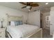 Spacious bedroom with king bed, ceiling fan and access to en-suite bathroom at 4925 New England Blvd # 204, New Port Richey, FL 34652