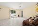 Living area with sliding glass doors leading to the backyard at 5640 81St N Ave, Pinellas Park, FL 33781