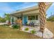 Inviting front porch with seating, colorful plants, and a freshly painted blue door that enhance curb appeal at 5901 1St Ne St, St Petersburg, FL 33703