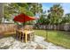 Outdoor patio with dining table and umbrella at 5901 1St Ne St, St Petersburg, FL 33703