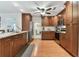 Updated kitchen, featuring stainless steel appliances and wood cabinets at 6212 43Rd N Ave, Kenneth City, FL 33709