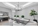 Elegant dining room with chandelier and modern table setting at 6323 Vista Verde E Dr, St Petersburg, FL 33707