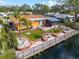 Backyard oasis with canal views, brick patio, and tropical landscaping at 6888 121St N St, Seminole, FL 33772