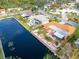 Bird's-eye view of waterfront homes with lush landscaping and a canal at 6888 121St N St, Seminole, FL 33772