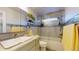 Bright bathroom featuring tiled walls, glass shower doors, and a sleek vanity at 6888 121St N St, Seminole, FL 33772