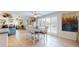 Dining area with tile floors, white table with seating for four and a bright open floorplan at 6888 121St N St, Seminole, FL 33772