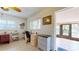 Bright home office features built-in desk and access to a screened porch at 6888 121St N St, Seminole, FL 33772