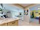 Open concept kitchen and dining area with tile flooring and granite countertops at 6888 121St N St, Seminole, FL 33772