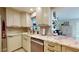 Modern kitchen with granite countertops, stainless steel appliances, and stylish backsplash at 6888 121St N St, Seminole, FL 33772