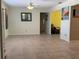 Open living room featuring neutral paint, tile flooring, and a decorative mirror at 6888 121St N St, Seminole, FL 33772