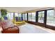 Relaxing sunroom with canal views and comfortable seating at 6888 121St N St, Seminole, FL 33772