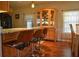 Granite countertop kitchen with breakfast bar and wood cabinetry at 72 Liberty Way # 4, Palm Harbor, FL 34684