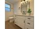 Modern bathroom featuring new vanity with black fixtures, updated lighting, and stylish mirror at 7521 Bougenville Dr, Port Richey, FL 34668
