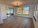 Bright dining area with sliding glass doors leading to the backyard at 7521 Bougenville Dr, Port Richey, FL 34668