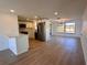 Open floorplan showcasing the kitchen with stainless appliances, and bright living area at 7521 Bougenville Dr, Port Richey, FL 34668