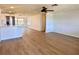 Open-concept living area with hardwood floors and abundant natural light at 7521 Bougenville Dr, Port Richey, FL 34668