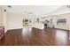 Spacious living room featuring hardwood floors that opens into a modern kitchen at 807 Leffingwell Ave, Ellenton, FL 34222