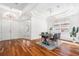 Elegant dining room with hardwood floors, modern chandelier, and ample natural light at 8334 Old Town Dr, Tampa, FL 33647