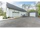 White double garage door and detached shed at 8611 Quail Hollow Blvd, Wesley Chapel, FL 33544