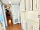 Long hallway with light wood floors and cabinets at 9790 66Th N St # 330, Pinellas Park, FL 33782