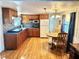 Eat-in kitchen with wood cabinets and laminate floors at 9790 66Th N St # 330, Pinellas Park, FL 33782