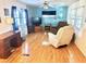 Living room with laminate floors and comfy seating at 9790 66Th N St # 330, Pinellas Park, FL 33782