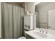 Bathroom with shower/tub combo and linen cabinet at 10025 Lake Wales Cir, Sarasota, FL 34241