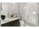 Bathroom featuring a walk-in shower and a vanity with a dark wood finish at 1003 Starboard Ct, Oldsmar, FL 34677