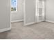 Bright bedroom with two windows and neutral carpet at 1003 Starboard Ct, Oldsmar, FL 34677