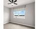 Bright bedroom with a ceiling fan and a large window overlooking the water at 1003 Starboard Ct, Oldsmar, FL 34677