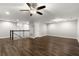 Spacious bonus room with hardwood floors and neutral paint, perfect for entertaining at 1003 Starboard Ct, Oldsmar, FL 34677