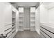 Spacious walk-in closet with built-in shelves and drawers for optimal storage at 1003 Starboard Ct, Oldsmar, FL 34677